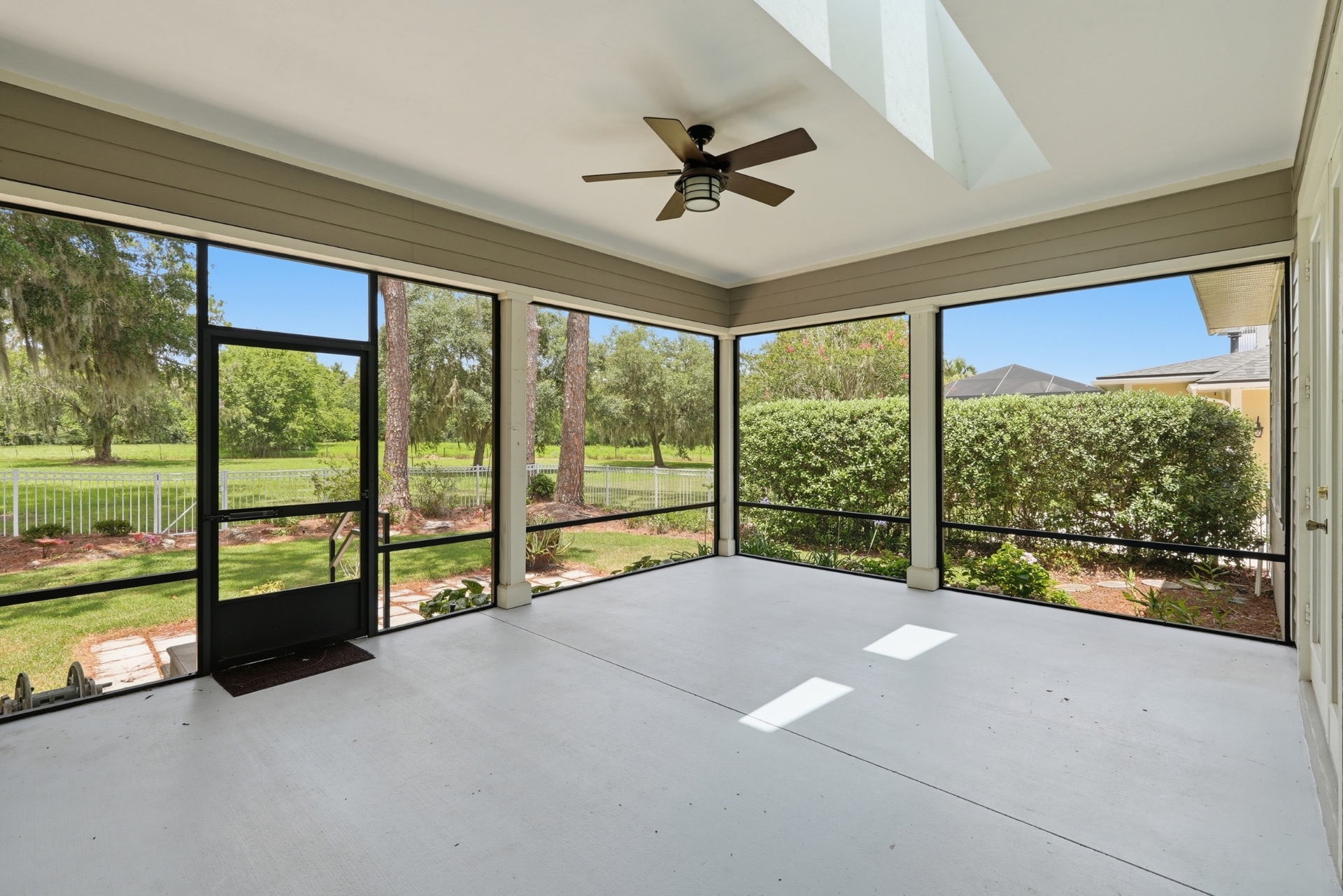Screened lanai overlooking the conservation backdrop